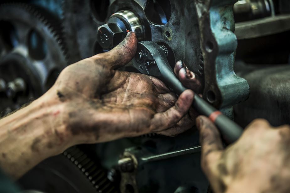 A student holds a wrench