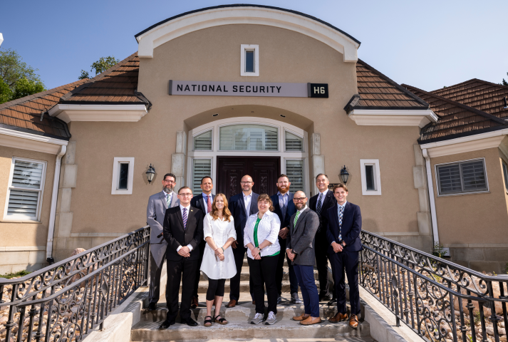 NSS Faculty and Staff people standing in front of the National Security building