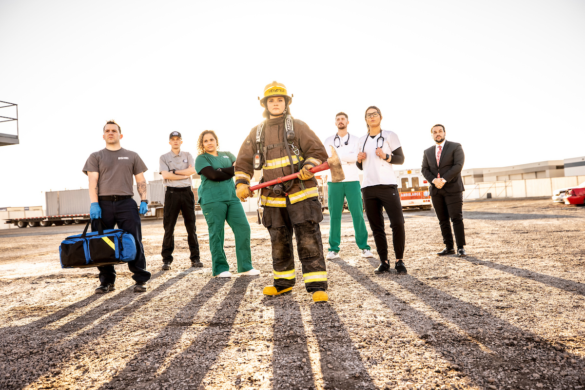 paramedics, fire fighters, first responders posing for a group photo