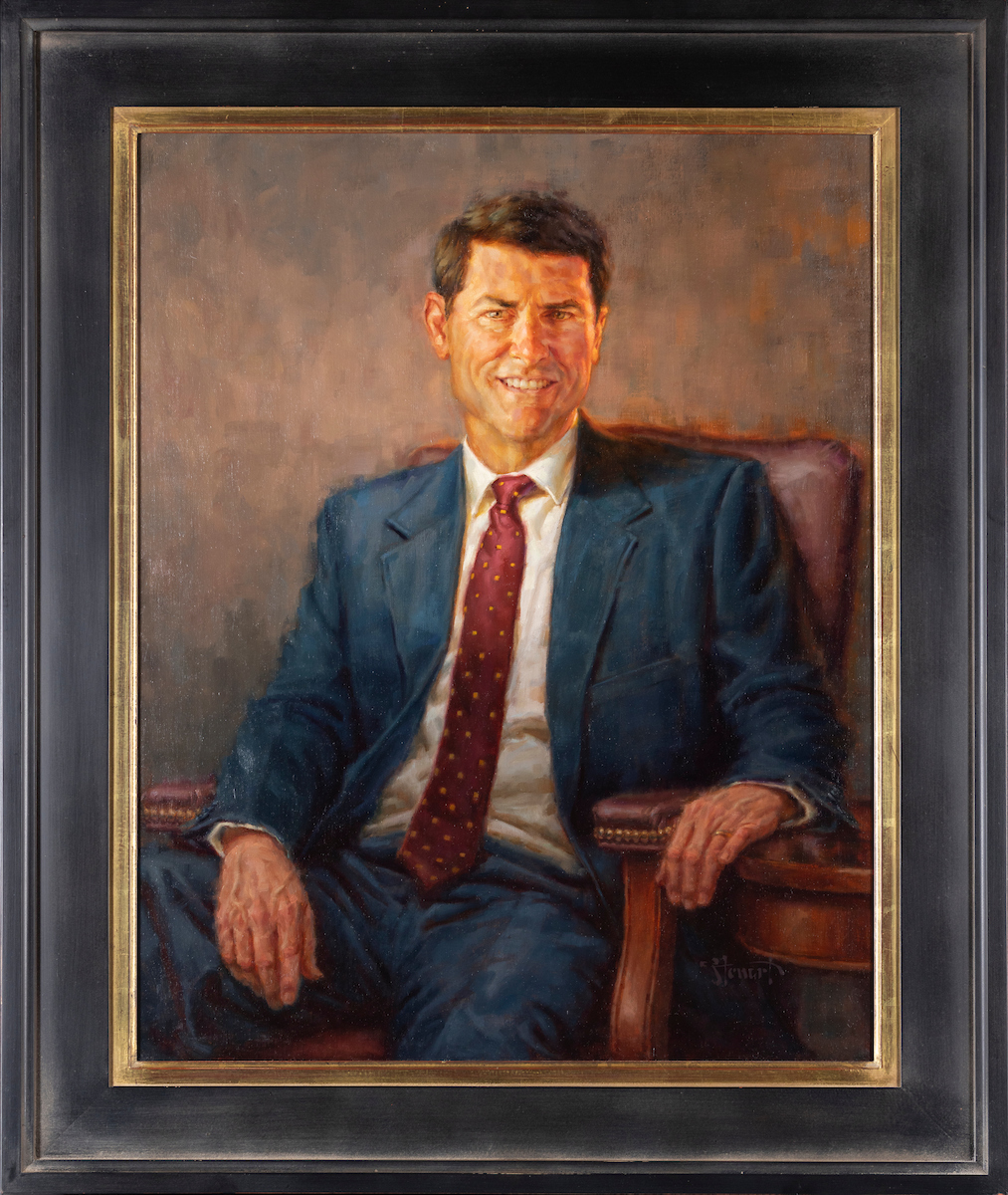 Portrait of Kerry D. Romesburg painted by Perry Stewart. In the portrait Romesburg is depicted as being seated in front of a muted background.