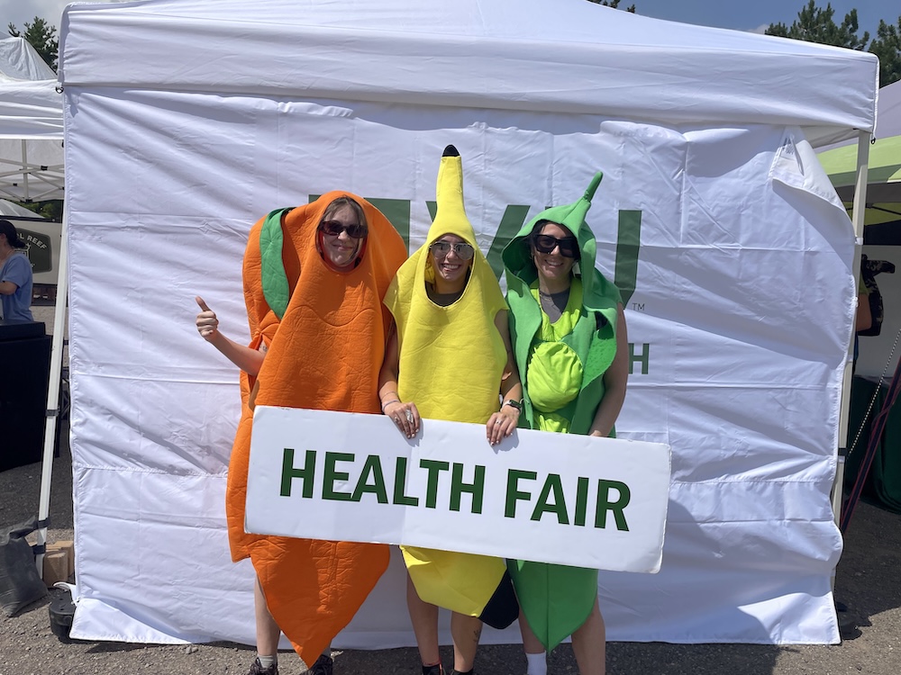 Public Health, B.S. Two women presenting infront of a white board.