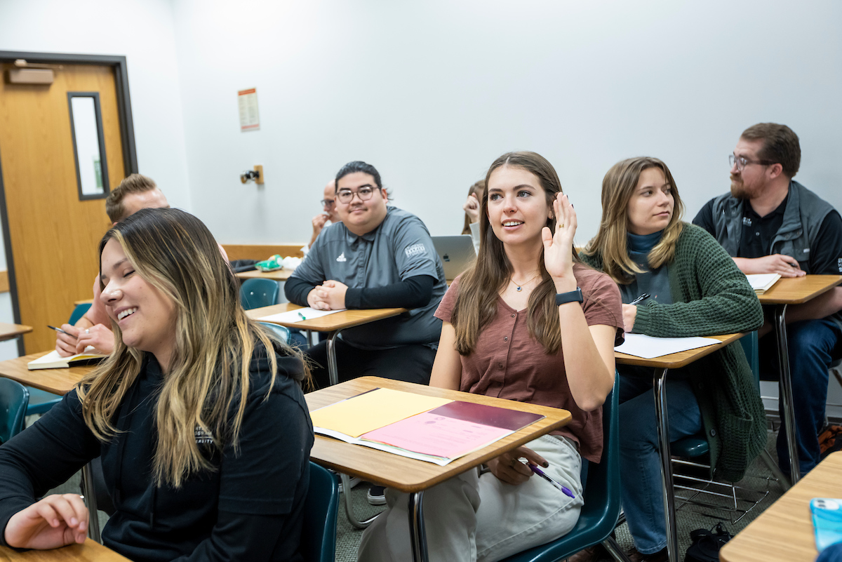 student raising their hand