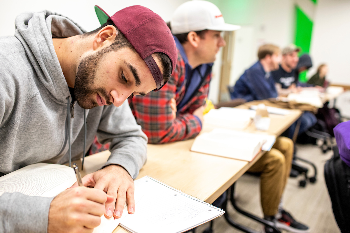 student taking notes