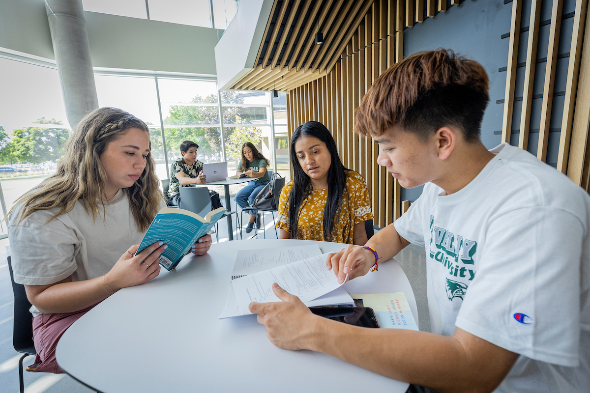 students huddled together at a table