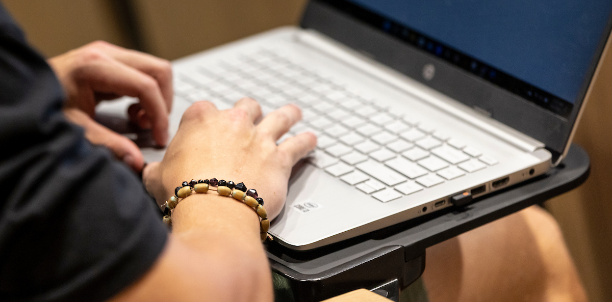 student on their laptop