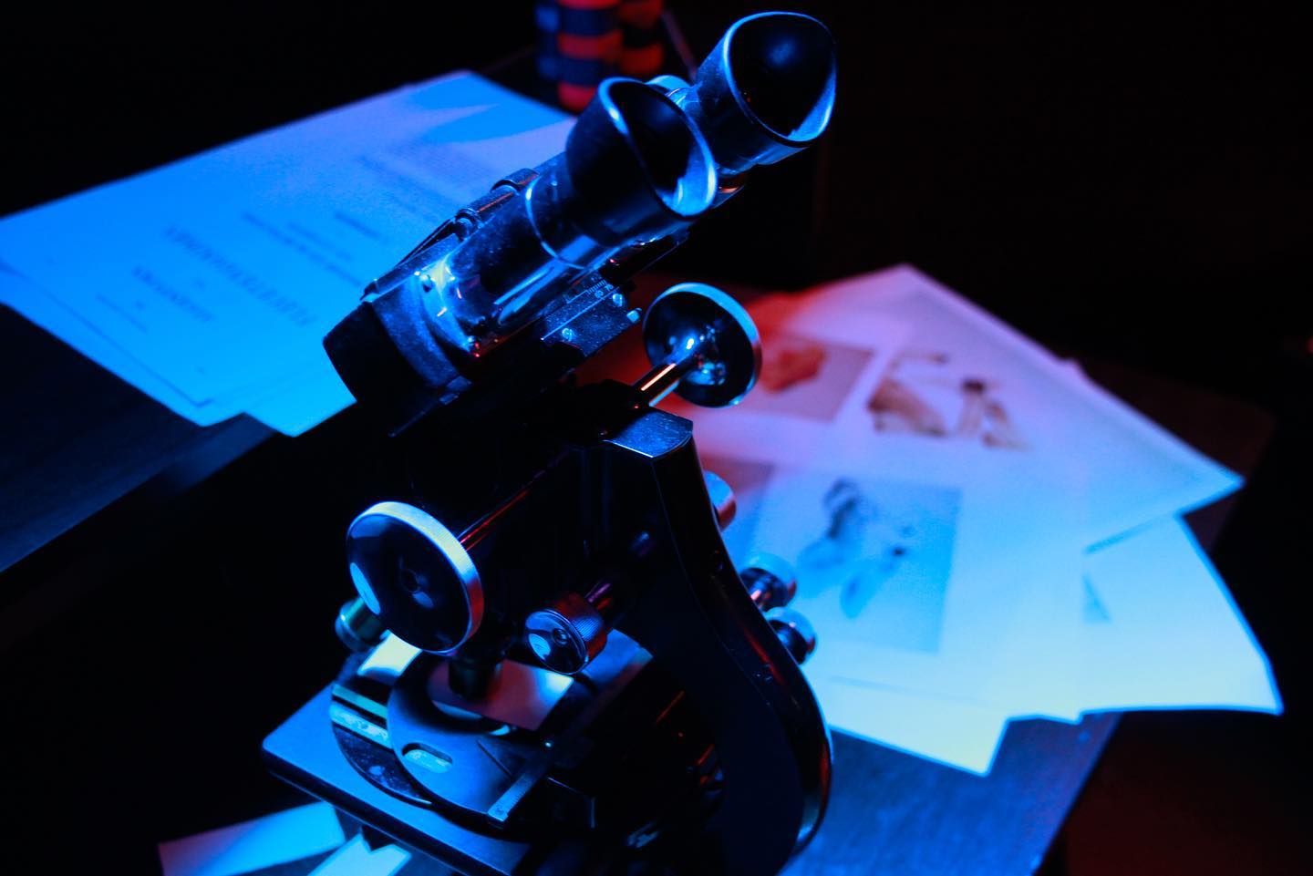 Image of a microscope in blue and red