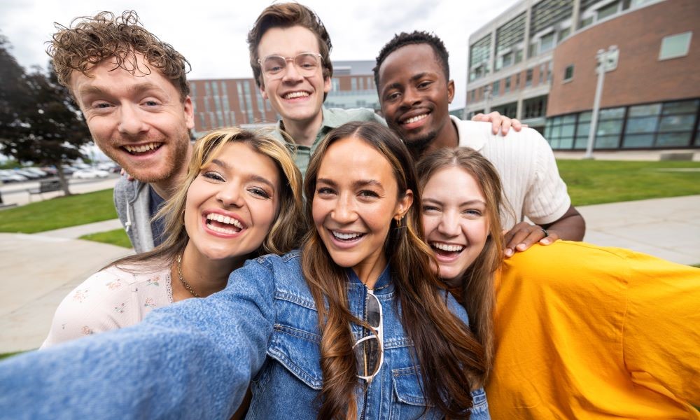 students taking a selfie on campus