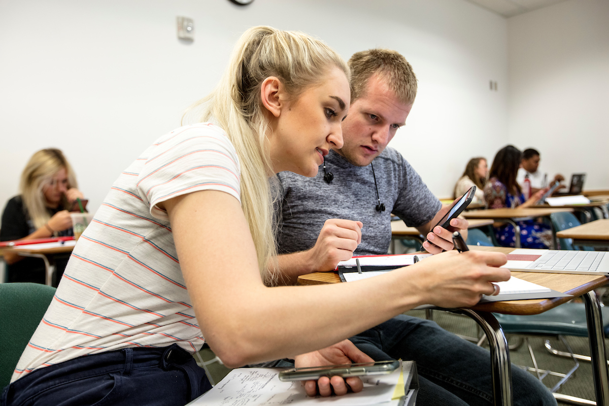 Image of two students studying