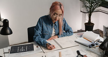 woman drafting blueprints