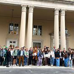 students in front of a historic building