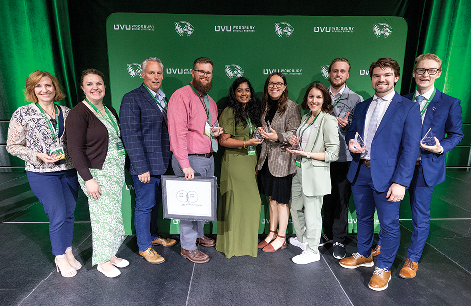 A group of students and faculty members from UVU’s Personal Financial Planning Program pose with their awards. 