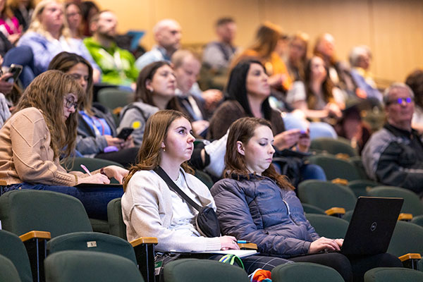 Image of a classroom with people in it, paying attetion