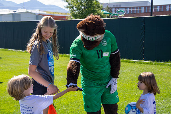 Willy Wolverine interacting with kids at an event