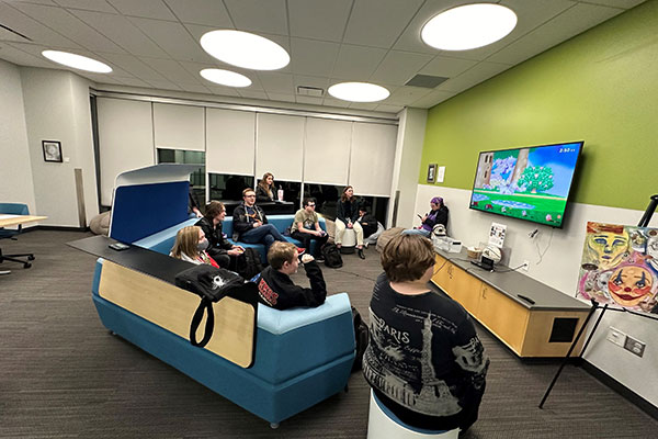 People playing a mario game in the MNCA lounge