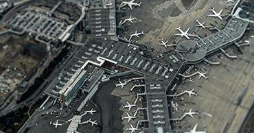 Aerial view of airport with multiple planes