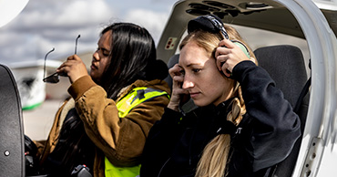 two women in the cockpit of a plane