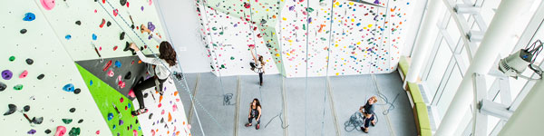 Students climbing at the UVU indoor climbing wall