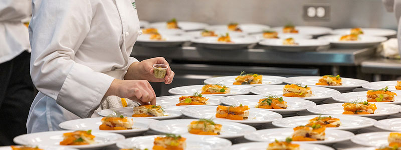 woman organizing plates of food