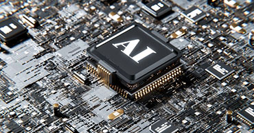 close up of a computer chip that reads "AI"