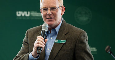 man speaking into a microphone