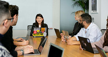 group of people sitting around a table