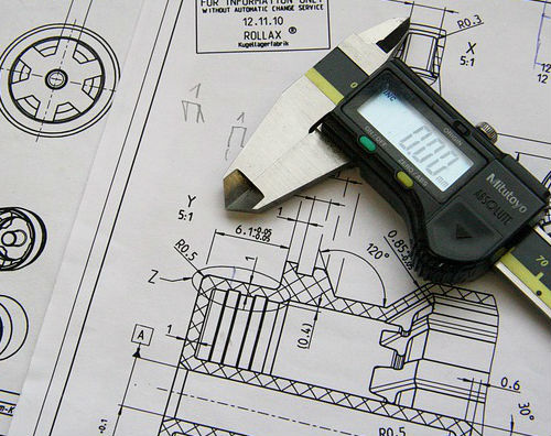 blueprints with a engineering ruler 