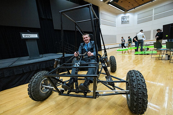 Student driving custom vehicle 