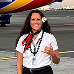 woman standing in front of a plane