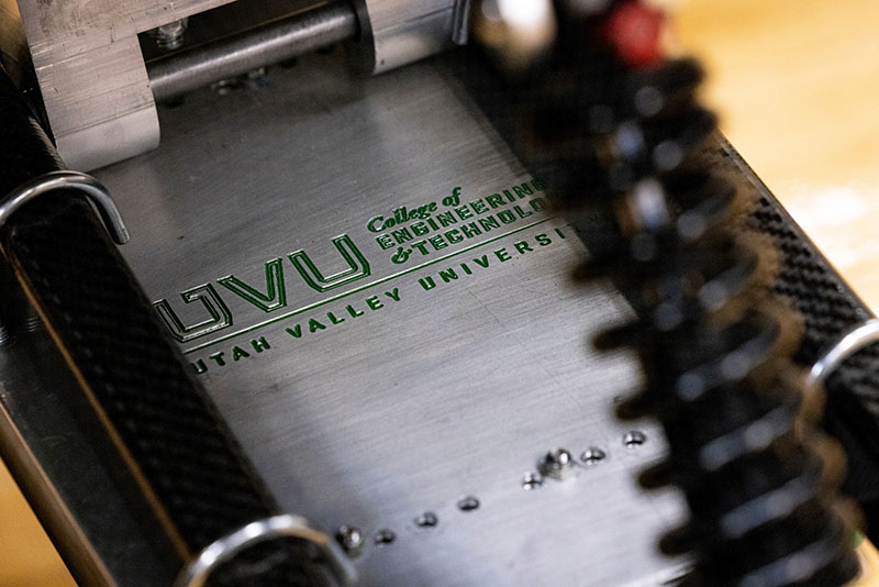 close up of the uvu engineering logo on a machine