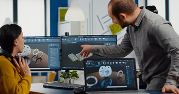 two people looking at computer screen