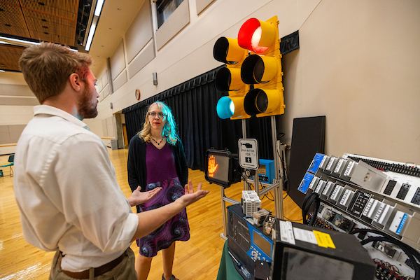 student presenting a traffic light project