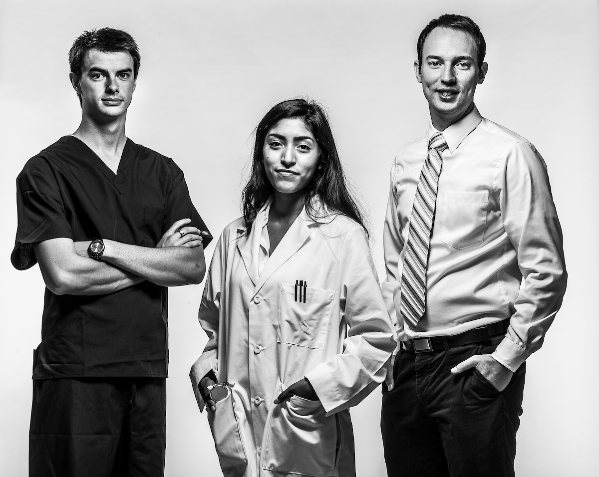 Students standing posing for a picture in greyscale