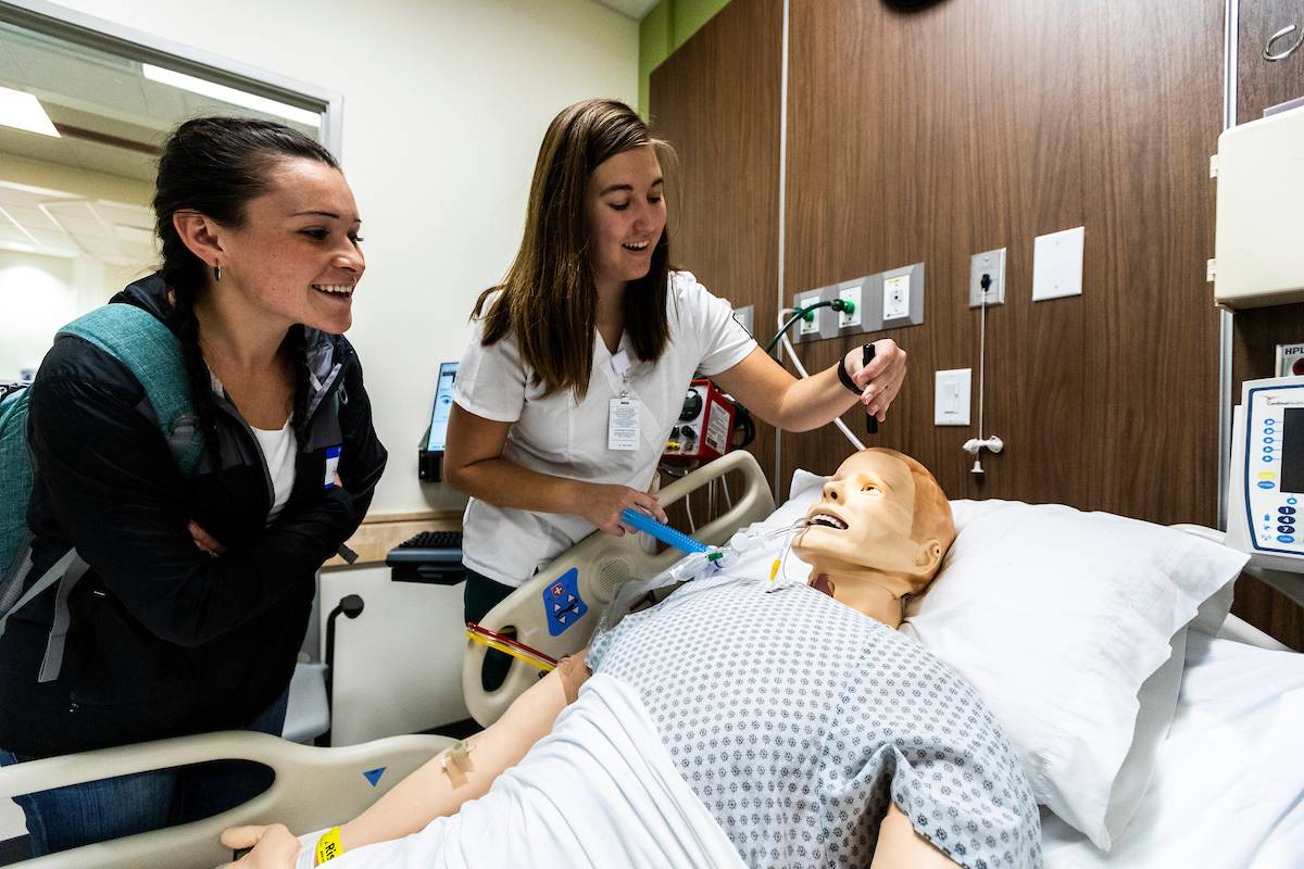 Students working with a dummy