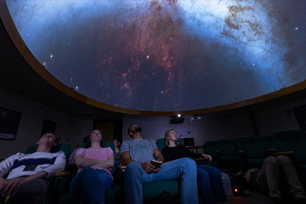 uvu students watching planetarium