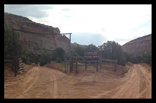 Fork in the road with sign for Capitol Reef Field Station and Pleasant Creek