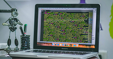 a laptop screen with lines of code