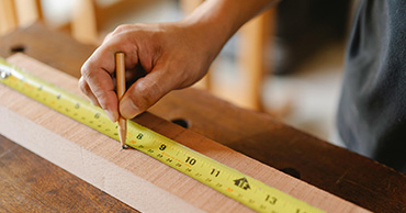 close up of a tape measurer on wood