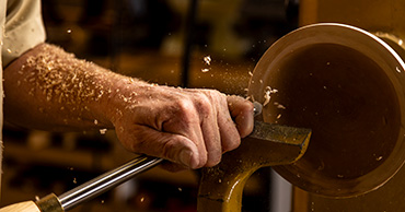 close up of a hand woodworking