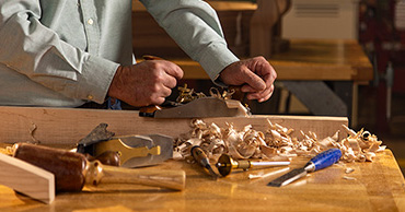man using woodworking tools