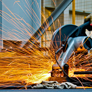 sparks shooting off of a piece of machinery