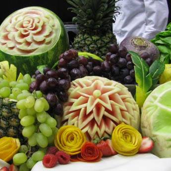 Carved melons with grapes and other fruit