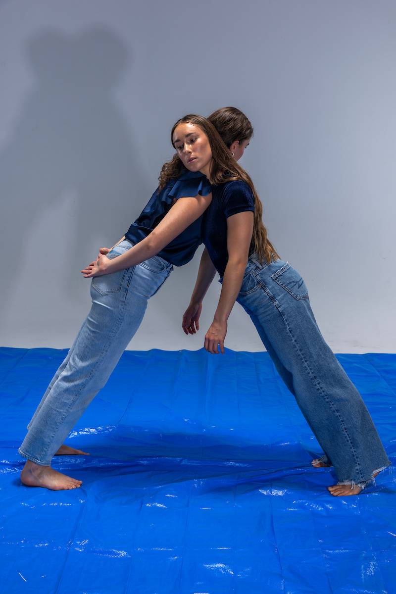 Two dancers leaning on each other - decorative image