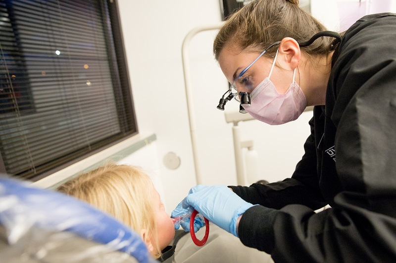 Dentist working on a child's teeth