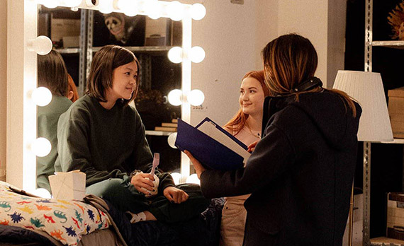 Students working in front of mirror