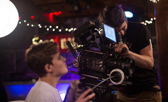 Two students working with camera