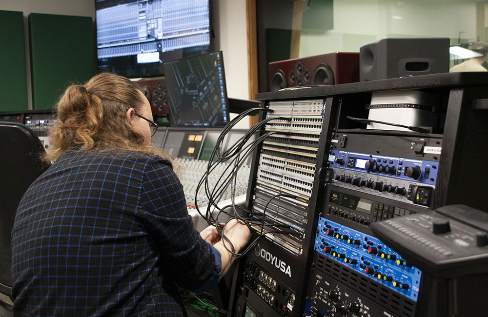 Man at audio editing station