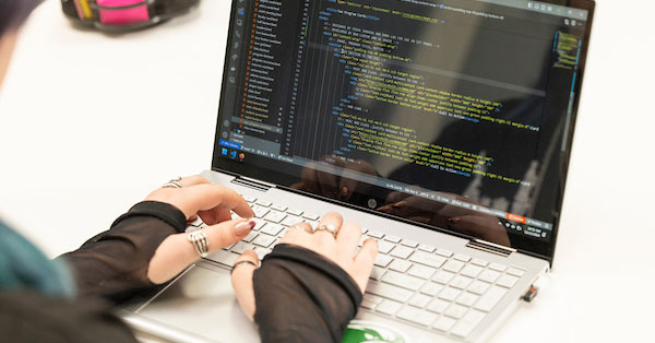 hands on a laptop keyboard