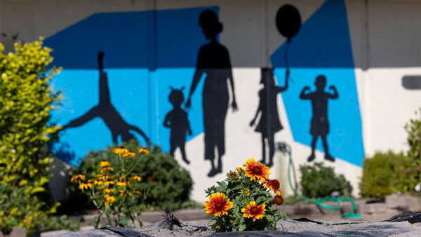 Mural of children playing at Wee Care