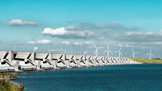 windmills on a dam