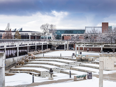 decorative image of snow-covered UVU courtyard and surrounding buildings